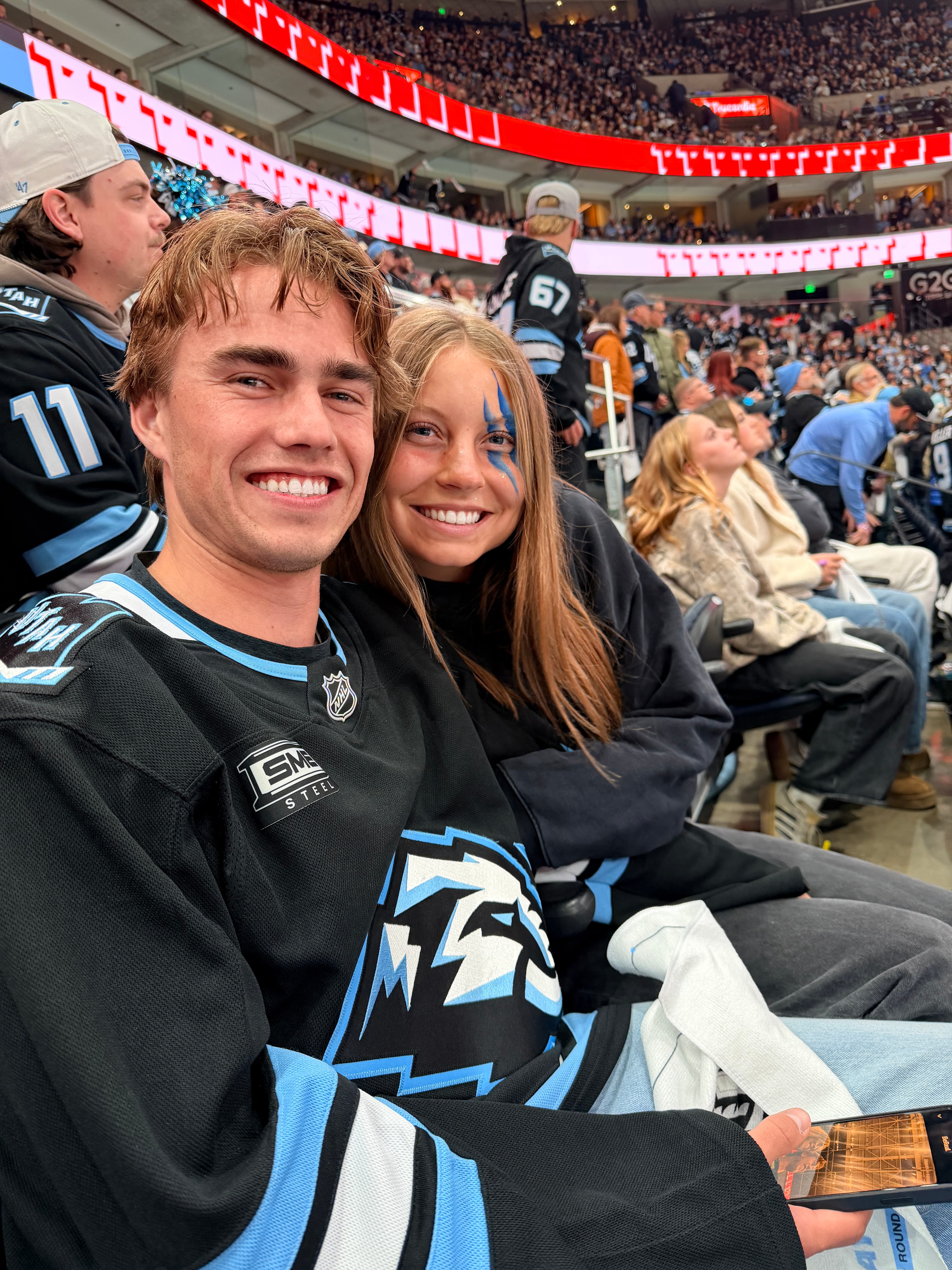 Carson and Courtney at a hockey game