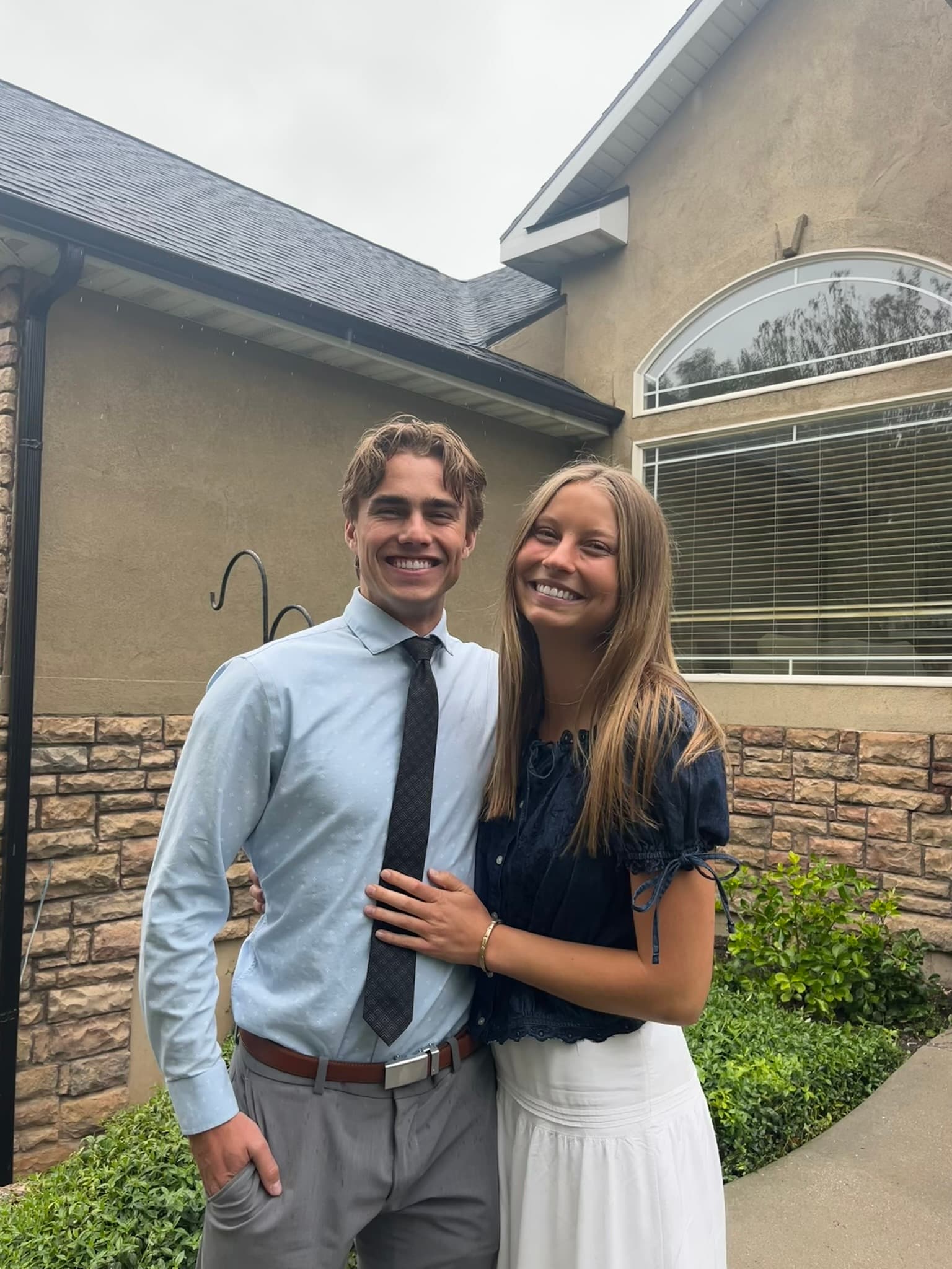 Carson and Courtney dressed up together outside