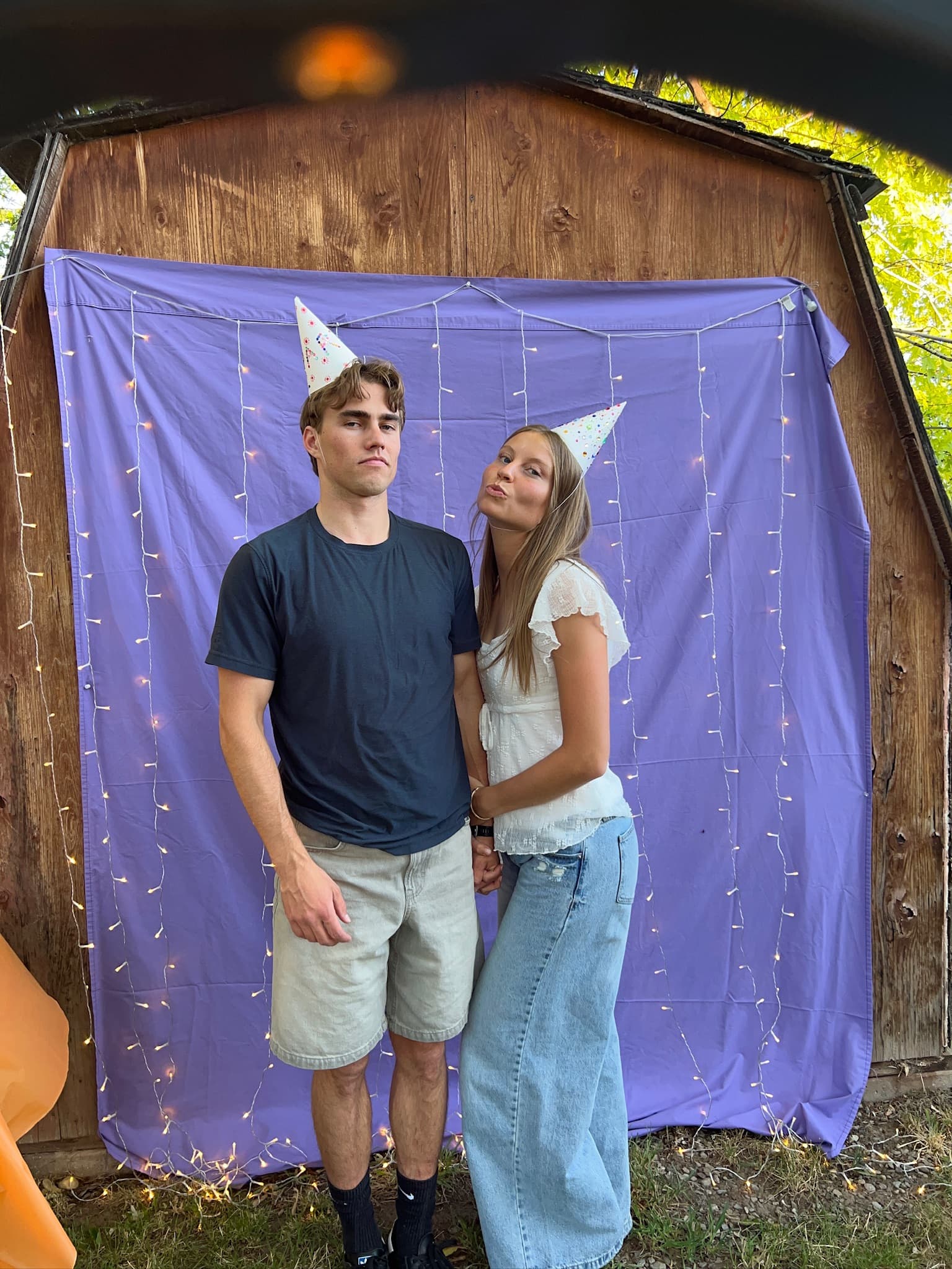 Carson and Courtney wearing party hats